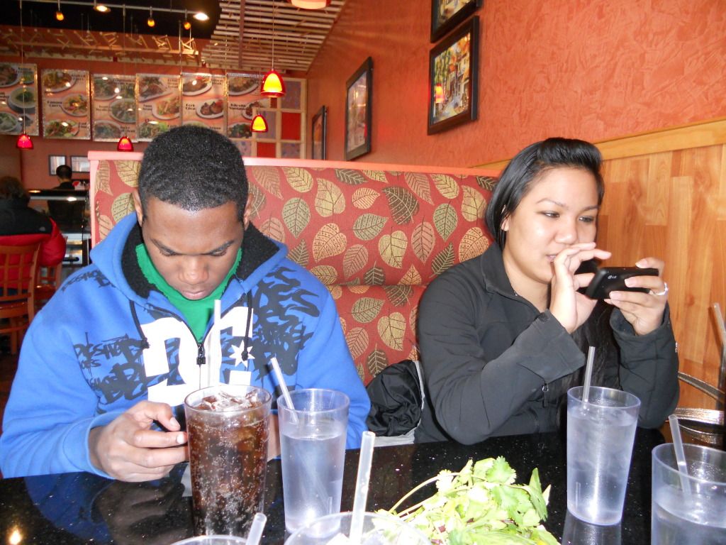 Playing games on their phones. No one cares about pictures. Playing games on their phones. No one cares about pictures.